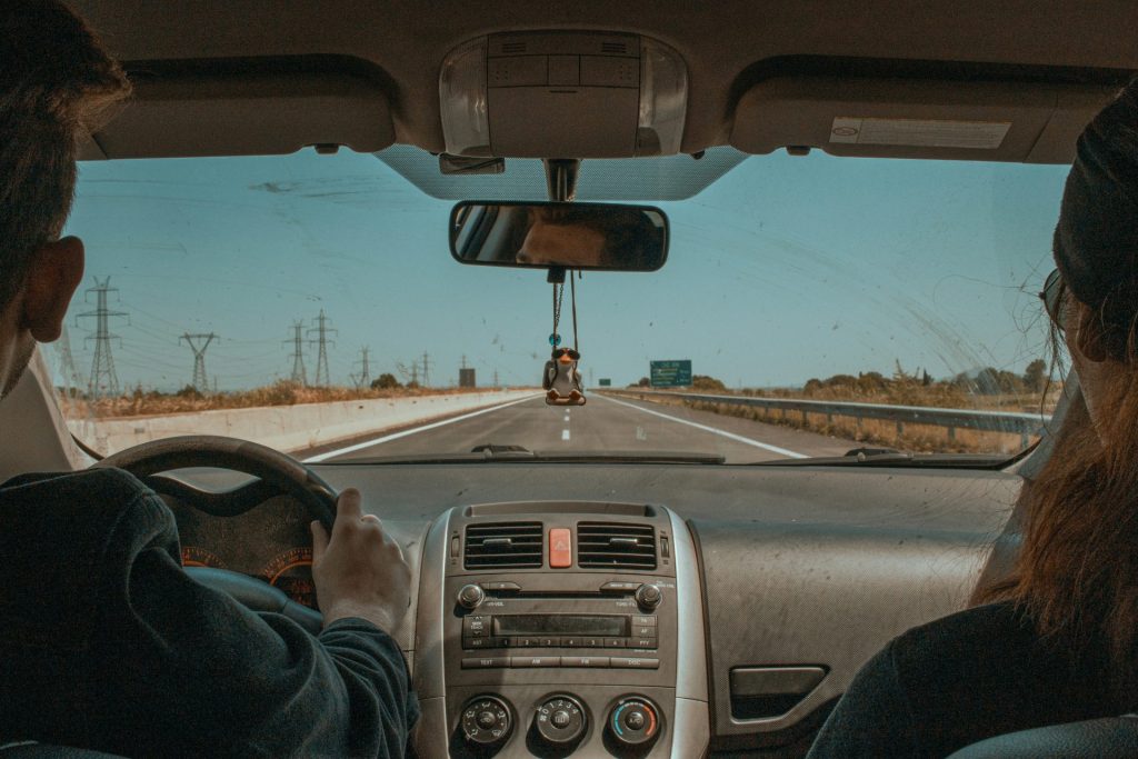 a couple of people that are in a car